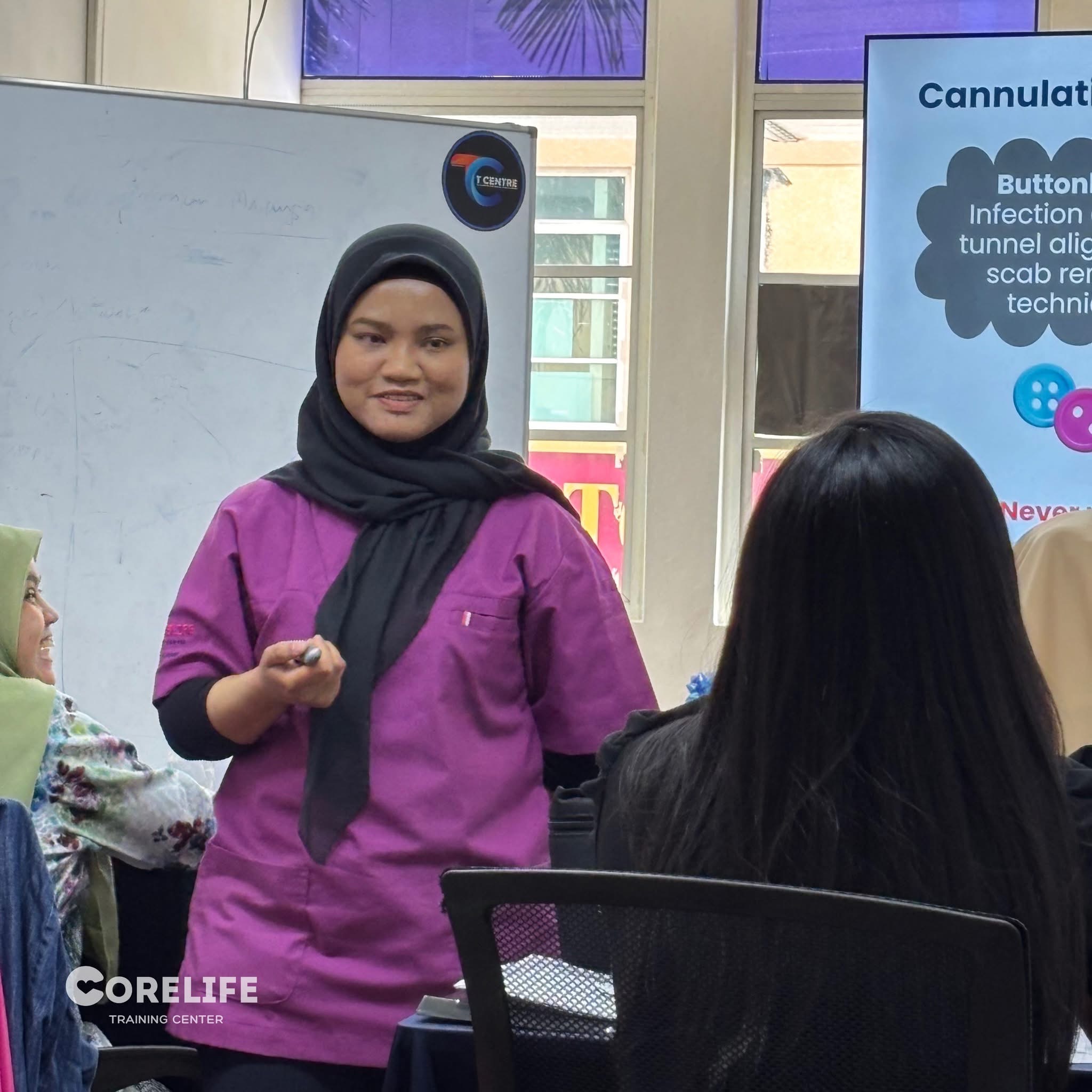 Participants seated and listening closely during a CoreLife training.